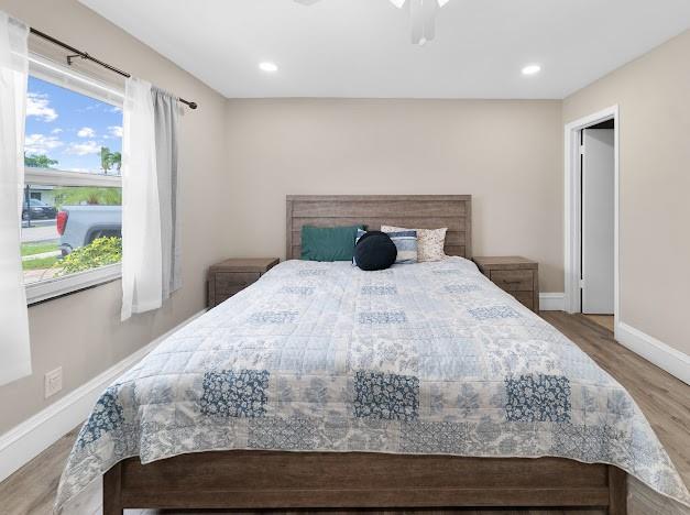 19426 Colorado Circle Boca Raton, FL 33434 - Photo 9 of 32 a bedroom with a bed and painting on the wall