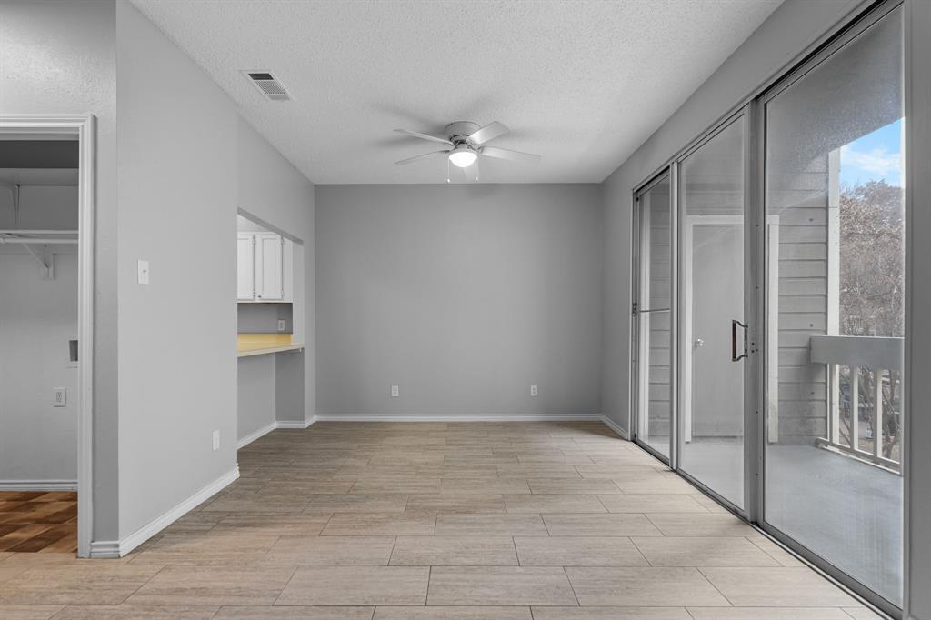 5310 Keller Springs Road, Unit 626 Dallas, TX 75248 - Photo 3 of 13 a view of an empty room with a window