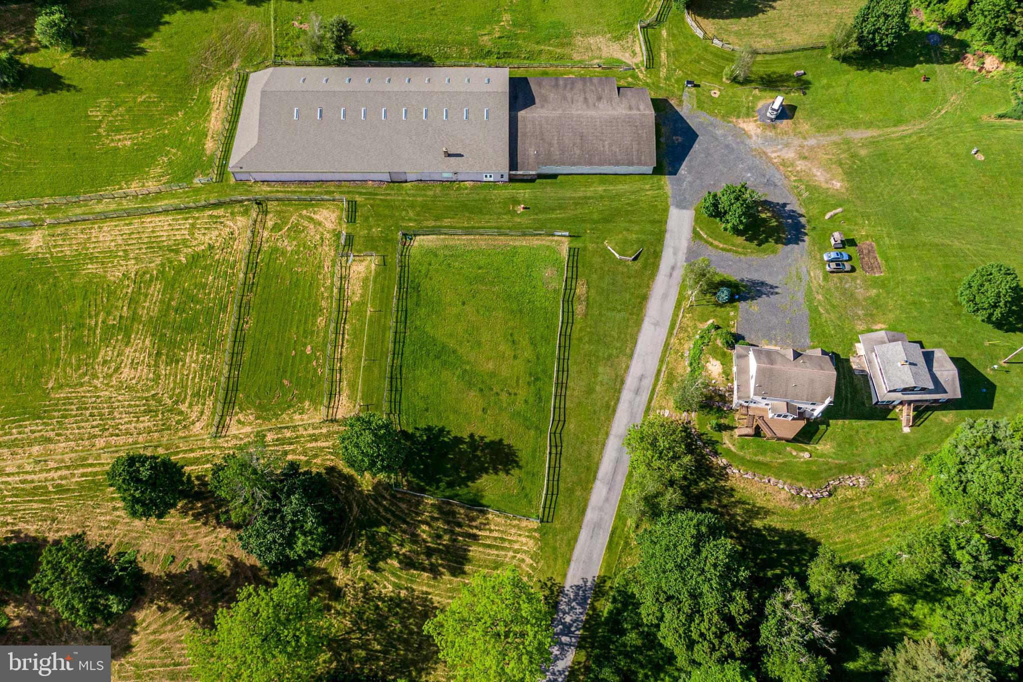 an aerial view of a house with a garden