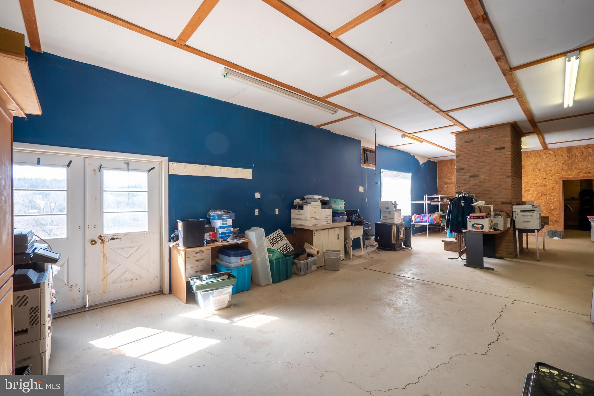 827 Pheasant Run Road Effort, PA 18330 - Photo 26 of 54 a view of a garage with furniture