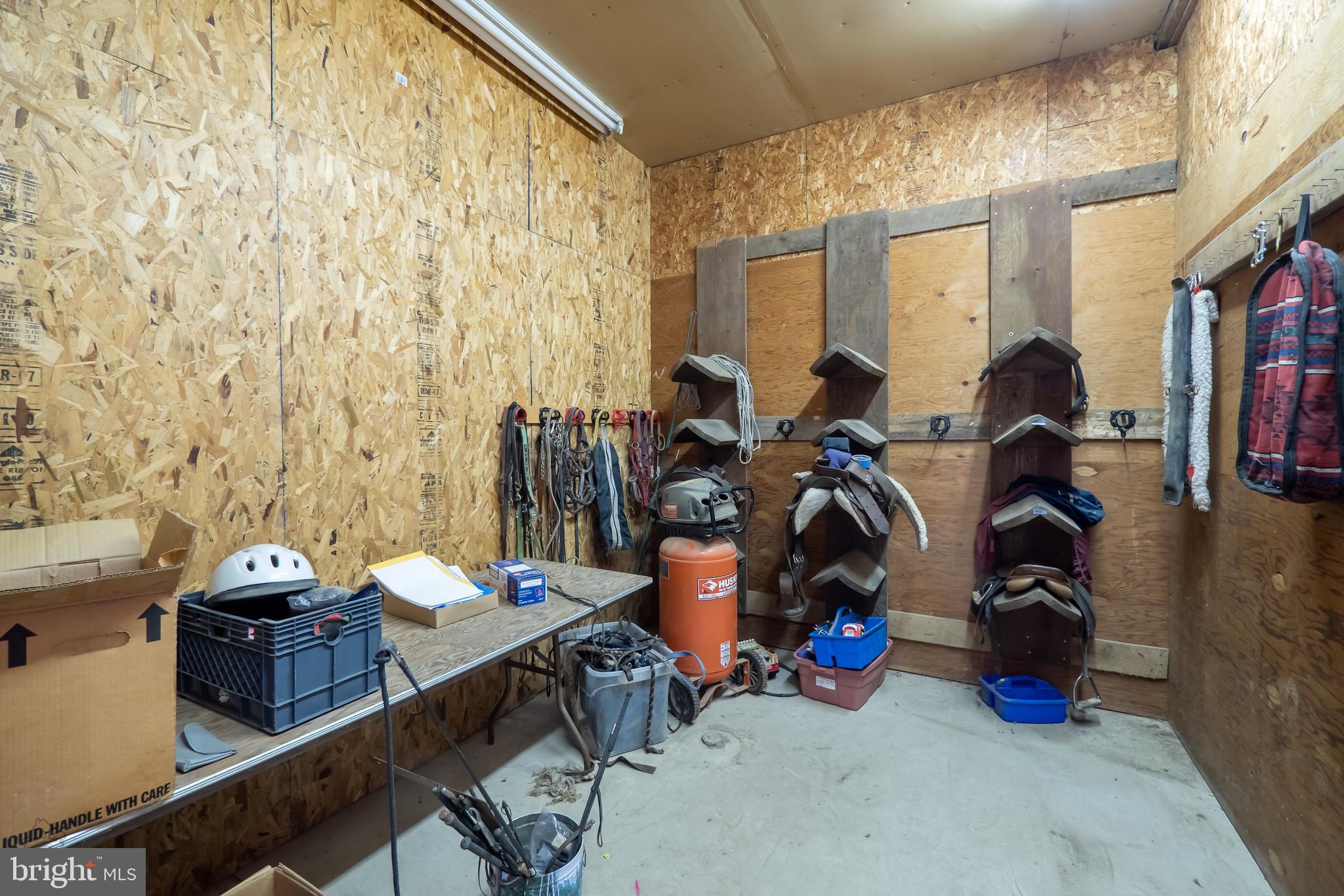 827 Pheasant Run Road Effort, PA 18330 - Photo 27 of 54 a room with furniture and a chandelier