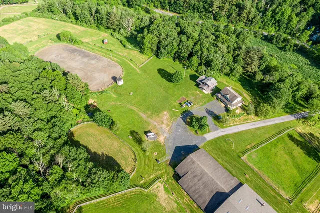 a view of a swimming pool with a yard