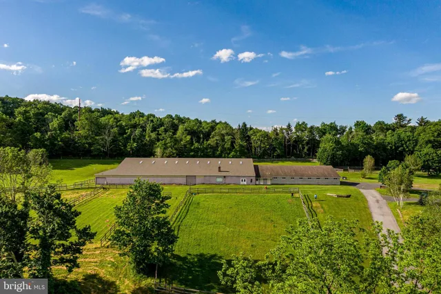 a view of a swimming pool with an outdoor space and seating area