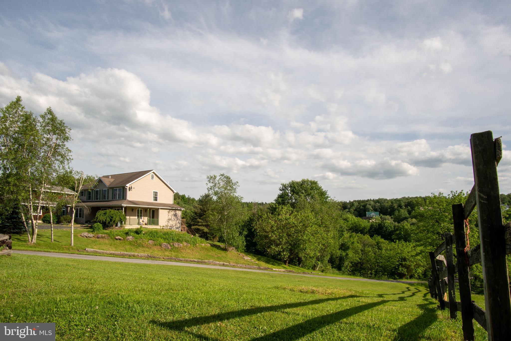 827 Pheasant Run Road Effort, PA 18330 - Photo 43 of 54 a front view of a house with a yard