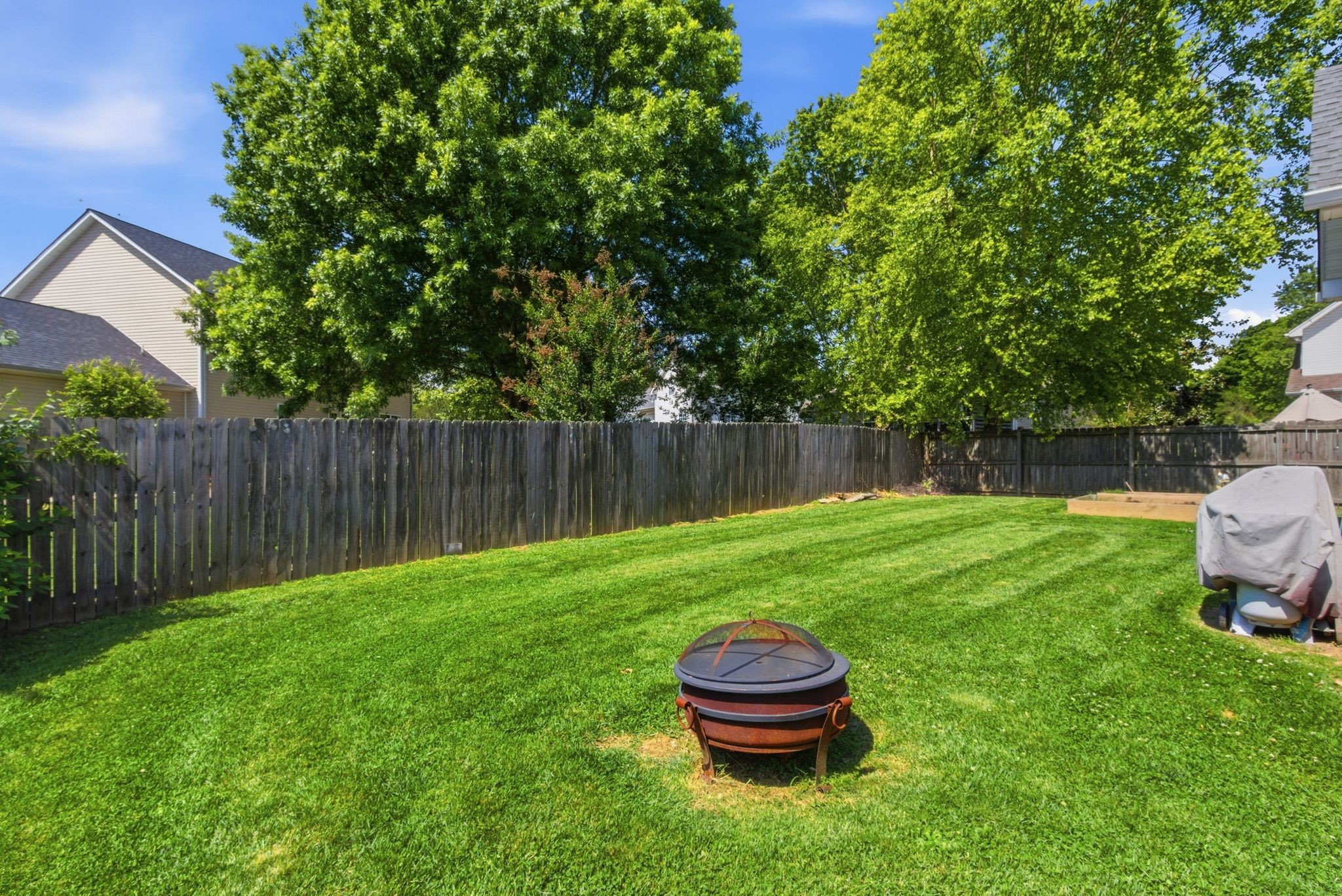 1503 Chapman Lane Spring Hill, TN 37174 - Photo 31 of 33 a view of a backyard with wooden fence
