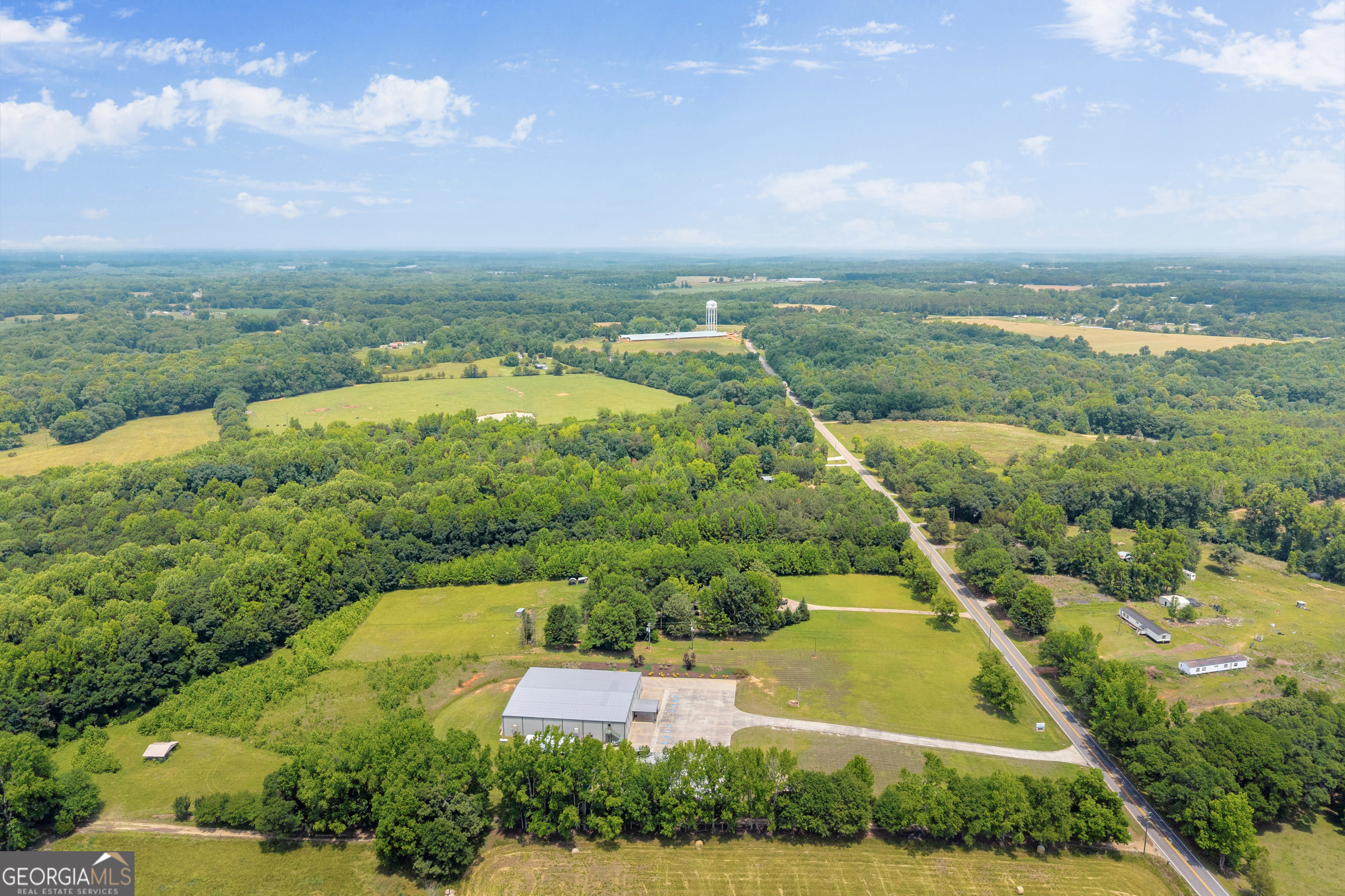 1270 Airline-Goldmine Road Canon, GA 30520 - Photo 102 of 107 an aerial view of residential houses with outdoor space and trees