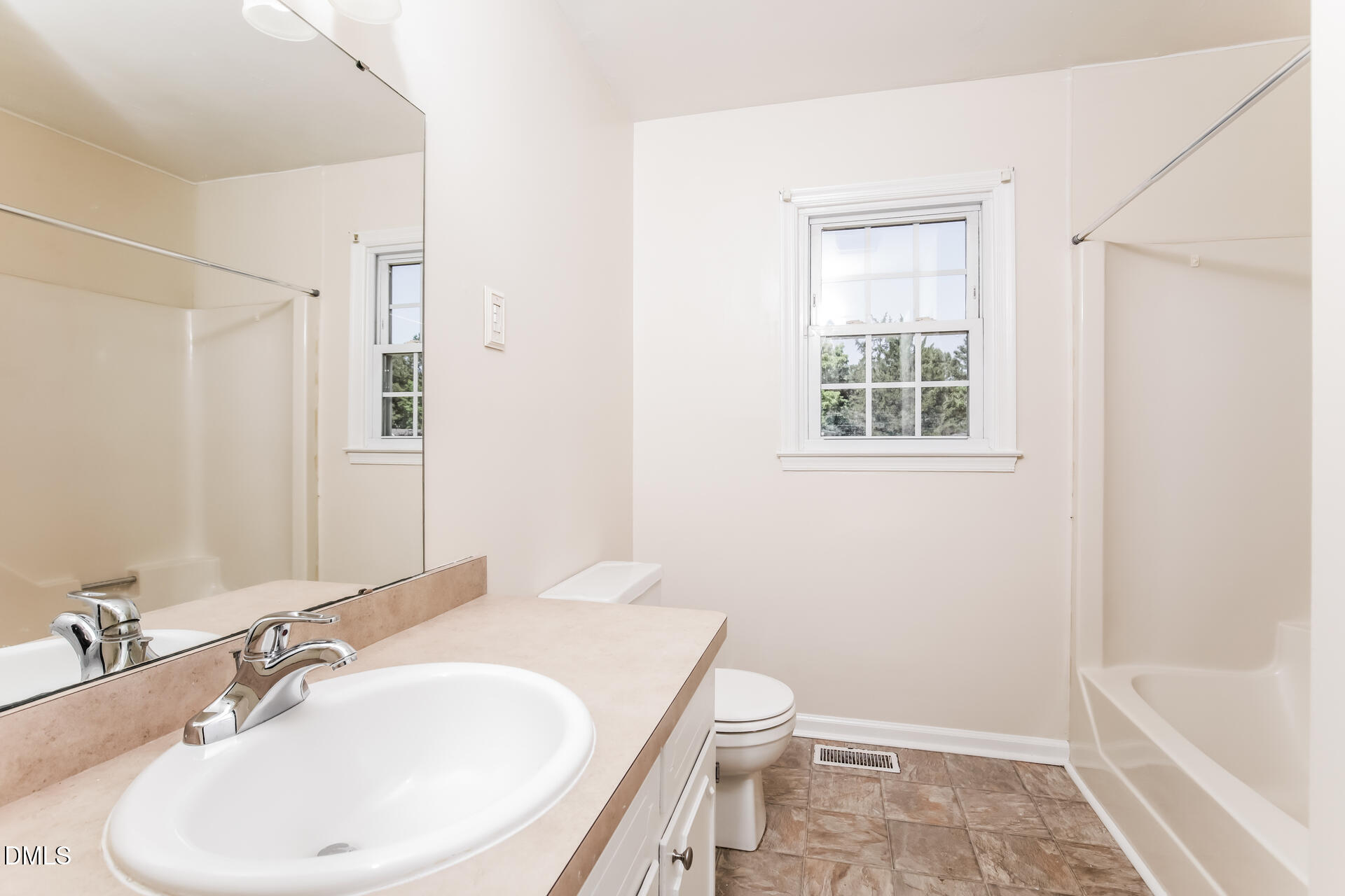 870 Abbott Road Henderson, NC 27537 - Photo 17 of 20 a bathroom with a sink toilet and shower