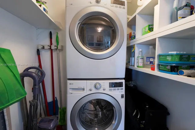 a view of a swimming pool with a patio and a yard