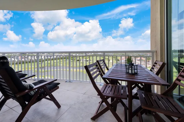 a view of balcony with wooden floor