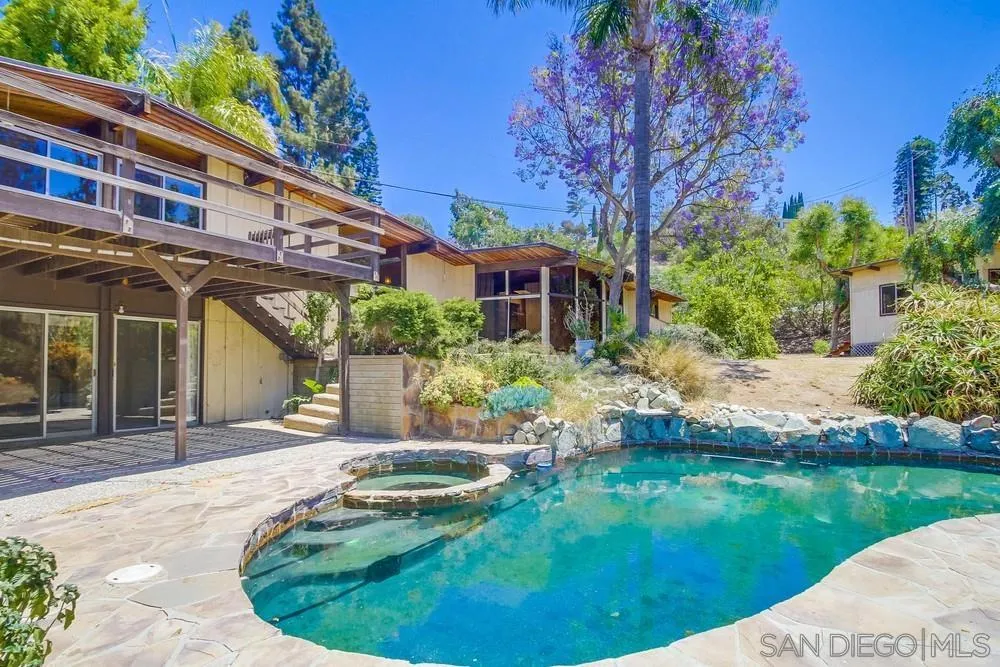 8680 Golf Drive Spring Valley, CA 91941 - Photo 13 of 70 a view of a house with a yard patio and a garden