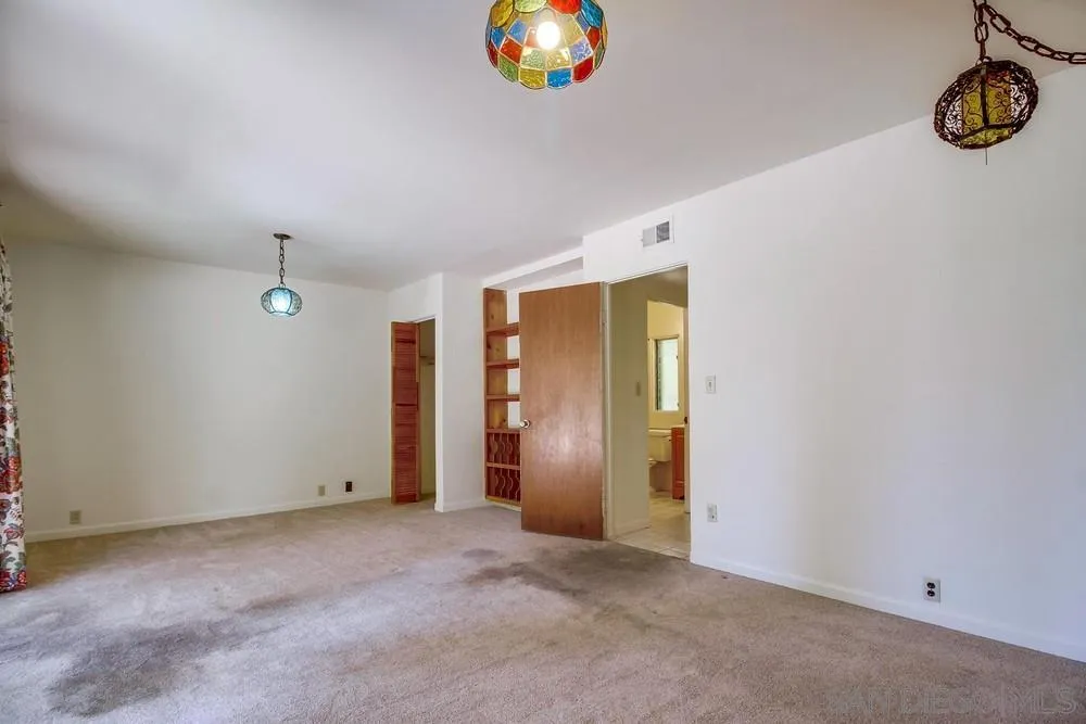 8680 Golf Drive Spring Valley, CA 91941 - Photo 35 of 70 an empty room with windows and entrance