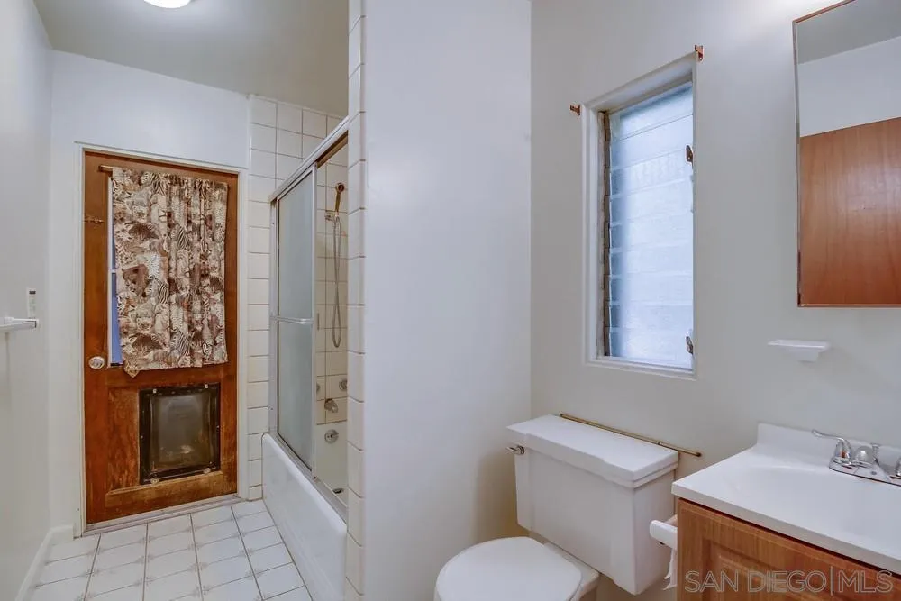 8680 Golf Drive Spring Valley, CA 91941 - Photo 38 of 70 a bathroom with a toilet sink and shower