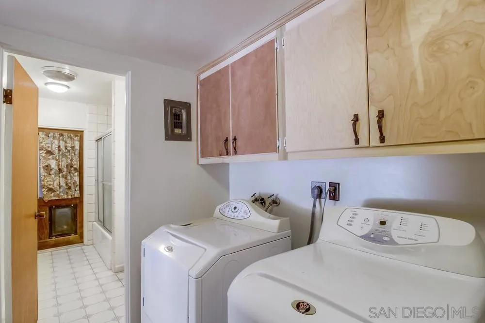 8680 Golf Drive Spring Valley, CA 91941 - Photo 39 of 70 a utility room with dryer and washer