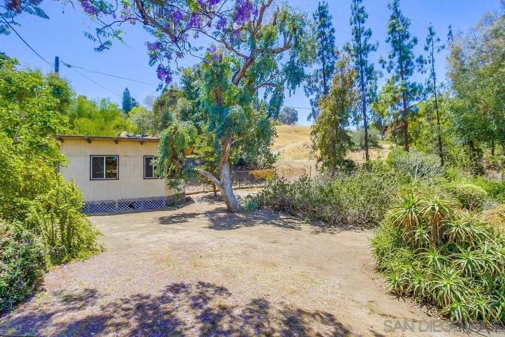 8680 Golf Drive Spring Valley, CA 91941 - Photo 49 of 70 a view of a house with a tree in the background