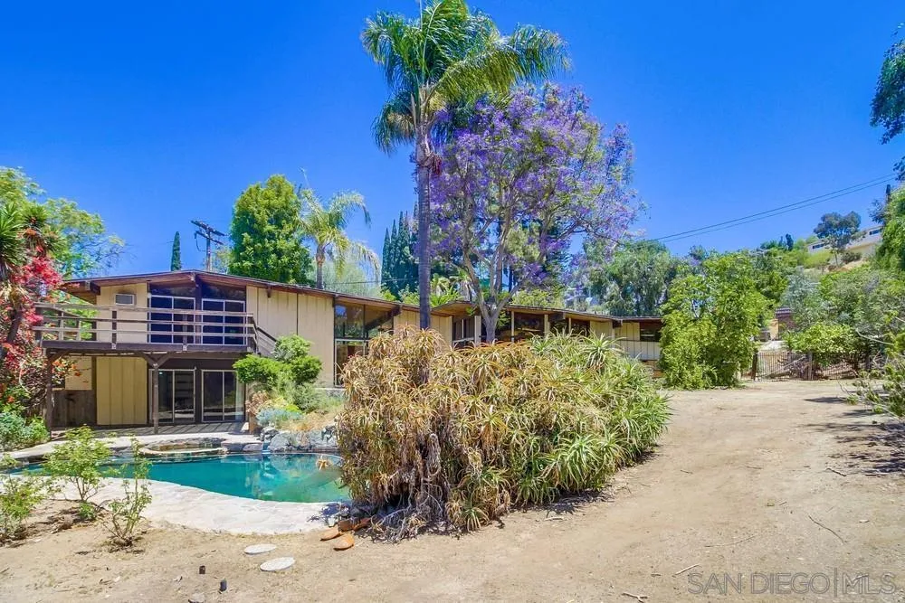 8680 Golf Drive Spring Valley, CA 91941 - Photo 53 of 70 a front view of a house with a garden