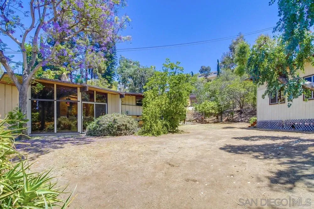 8680 Golf Drive Spring Valley, CA 91941 - Photo 56 of 70 front view of a house with a trees