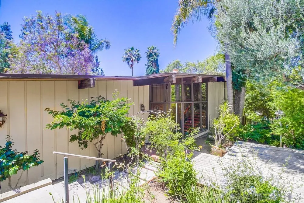 8680 Golf Drive Spring Valley, CA 91941 - Photo 64 of 70 a front view of a house with a yard