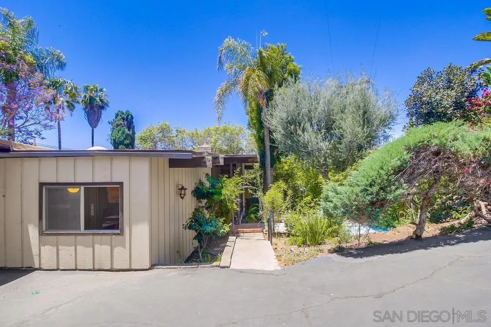 8680 Golf Drive Spring Valley, CA 91941 - Photo 65 of 70 a picture of a house with a yard and potted plants