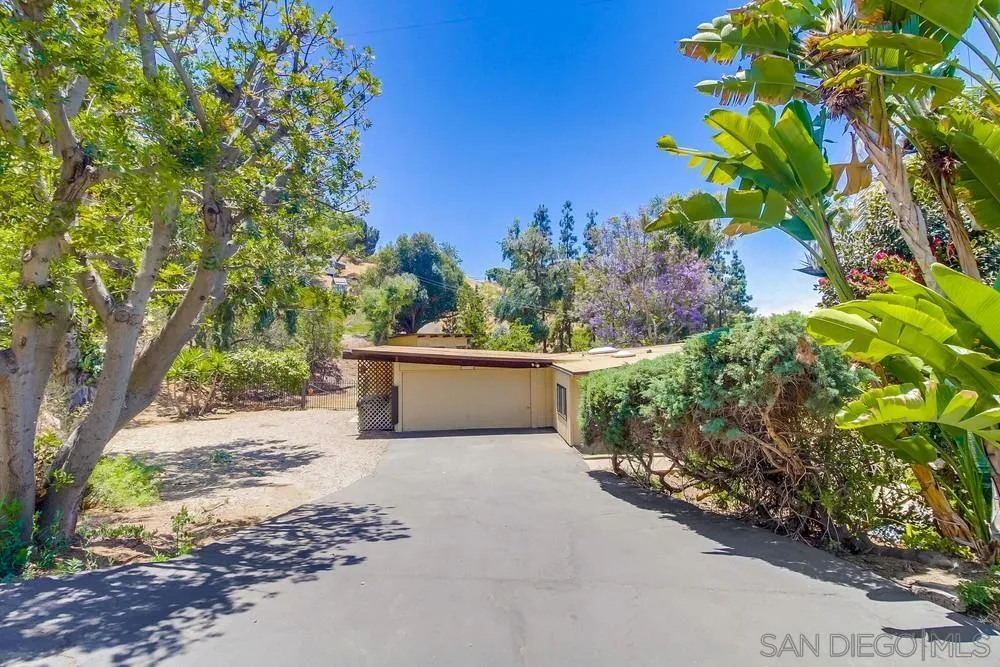 8680 Golf Drive Spring Valley, CA 91941 - Photo 66 of 70 a view of a house with a yard and garden