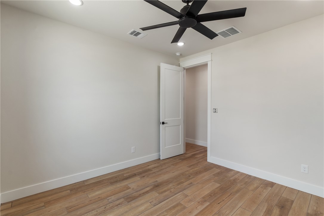 7822 Mathis Crk Drive Bryan, TX 77808 - Photo 25 of 43 wooden floor in an empty room