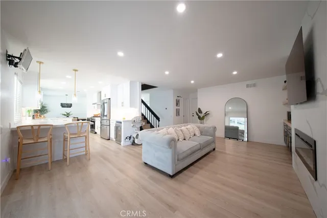 a spacious bedroom with a bed and a dresser