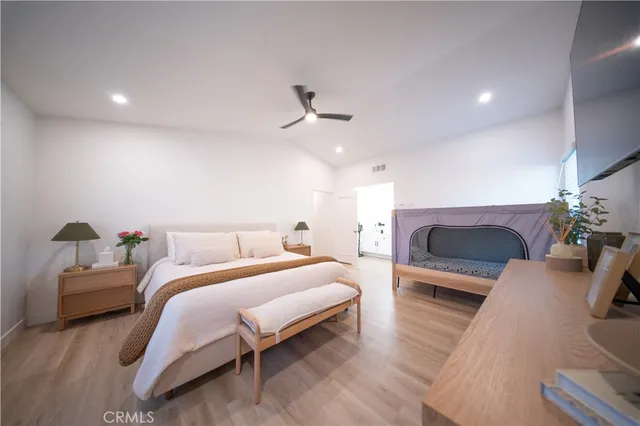 a spacious bathroom with a double vanity sink a mirror and a shower