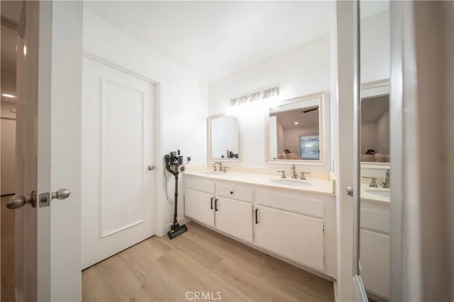 a bathroom with a granite countertop toilet and a shower