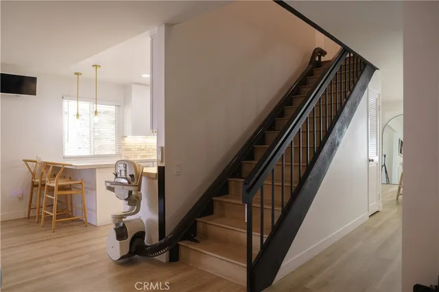 a large white kitchen with fireplace furniture and a window