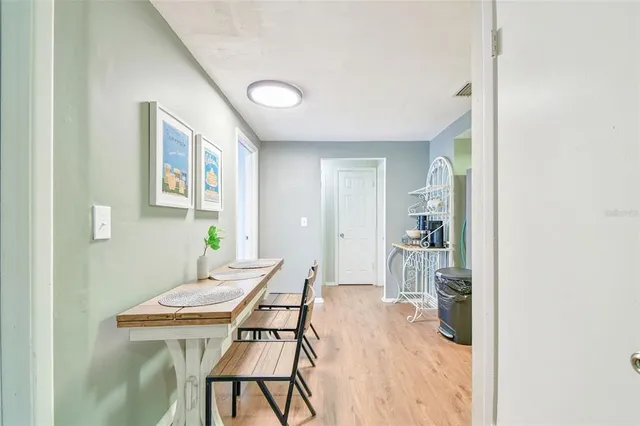 a room with a table and chairs