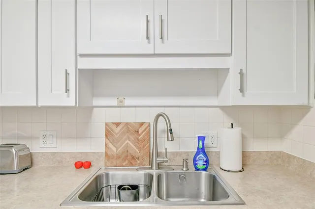 a kitchen with a stove and cabinets