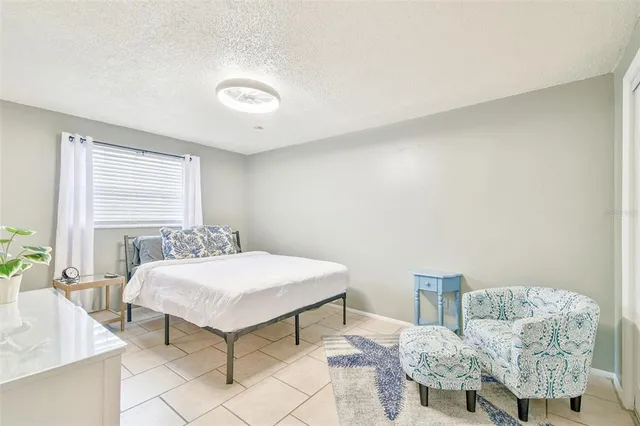 a bedroom with a bed and a table