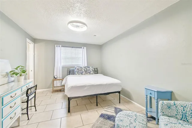 a bedroom with a bed and a cabinets