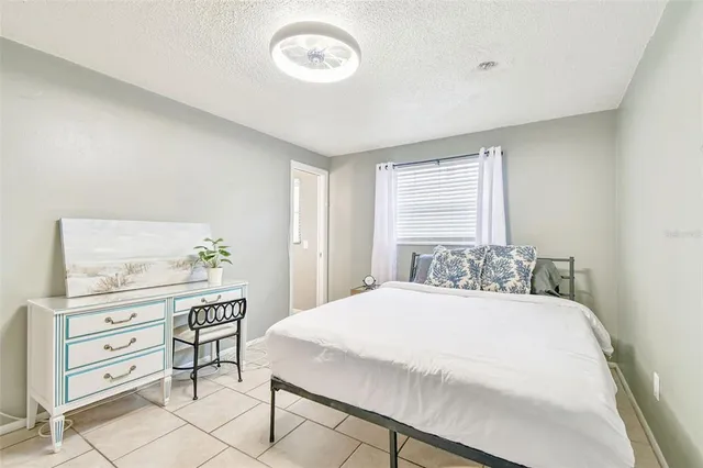 a bedroom with a bed and a cabinets