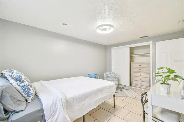 a bathroom with a sink toilet vanity and shower