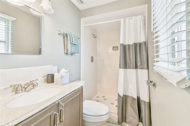 a bathroom with a shower curtain