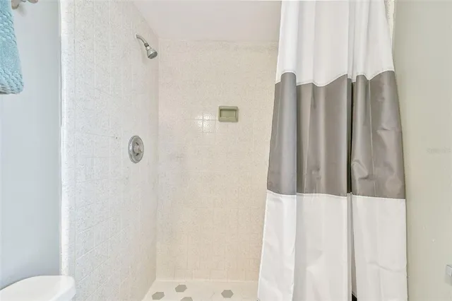 a bathroom with a sink vanity and a toilet