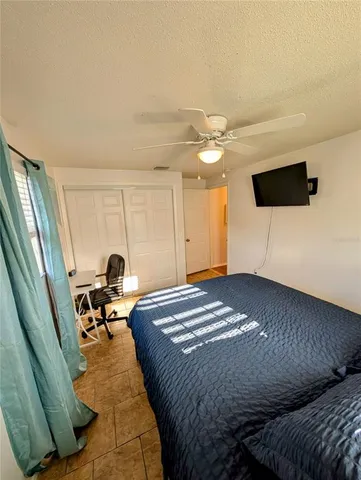a room with wooden floor and windows