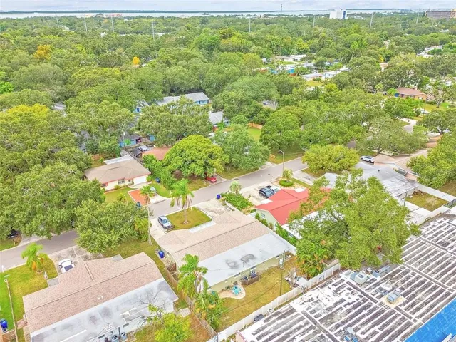 a view of swimming pool with outdoor seating and city view