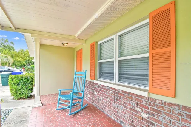 a backyard of a house with outdoor seating