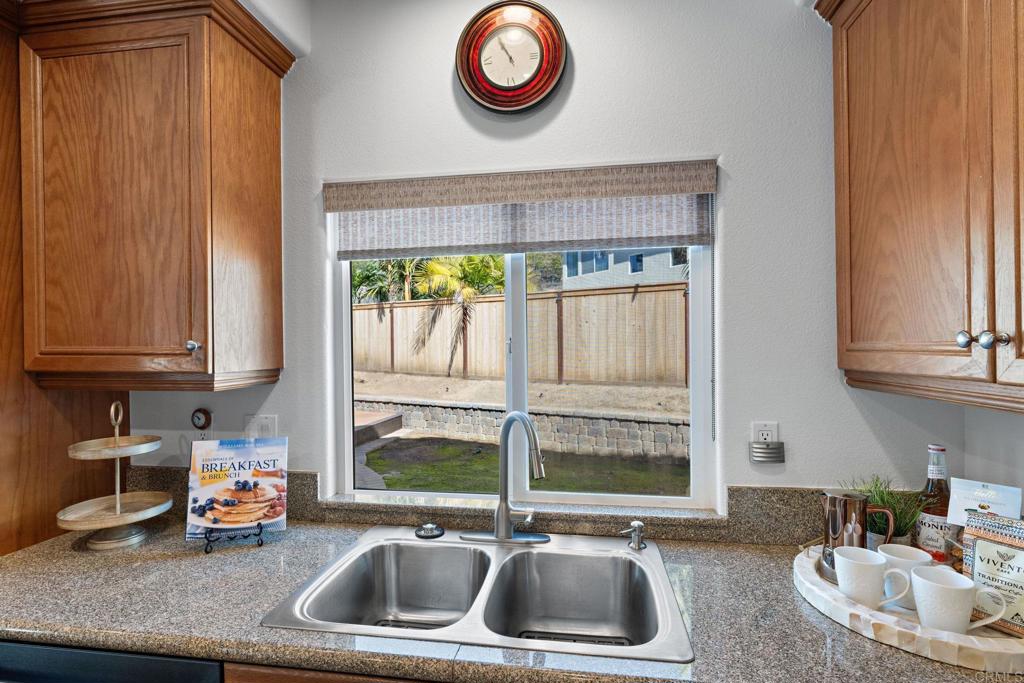 655 Dimaio Way Escondido, CA 92027 - Photo 18 of 46 a kitchen with a sink and a window