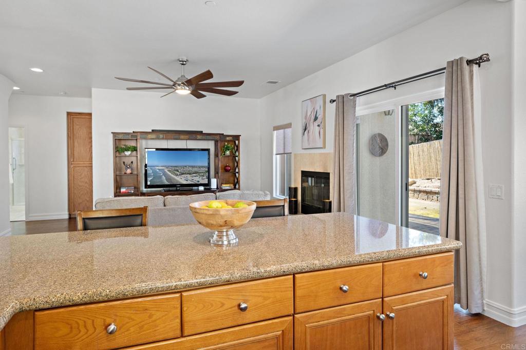 655 Dimaio Way Escondido, CA 92027 - Photo 19 of 46 a kitchen with stainless steel appliances granite countertop a sink a stove and a refrigerator
