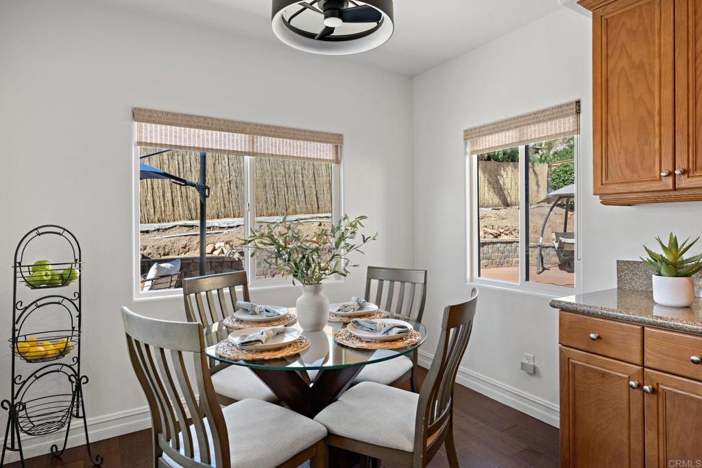 655 Dimaio Way Escondido, CA 92027 - Photo 20 of 46 a view of a dining room with furniture window and outside view