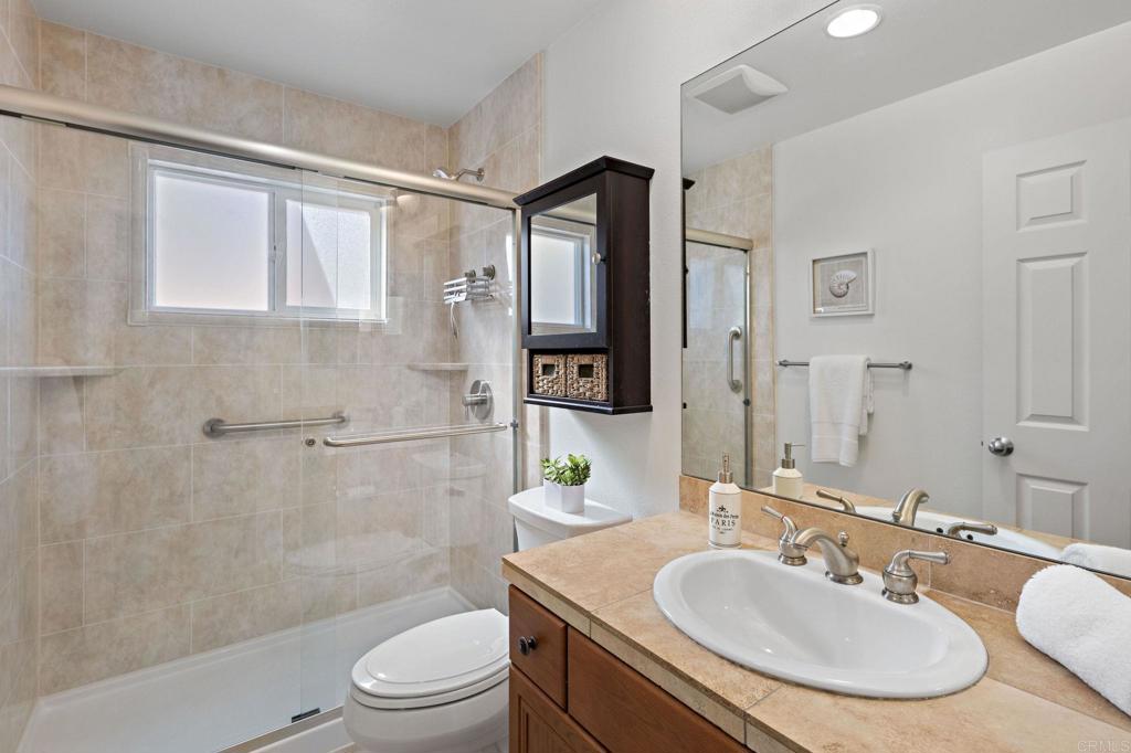 655 Dimaio Way Escondido, CA 92027 - Photo 22 of 46 a bathroom with a sink toilet and shower