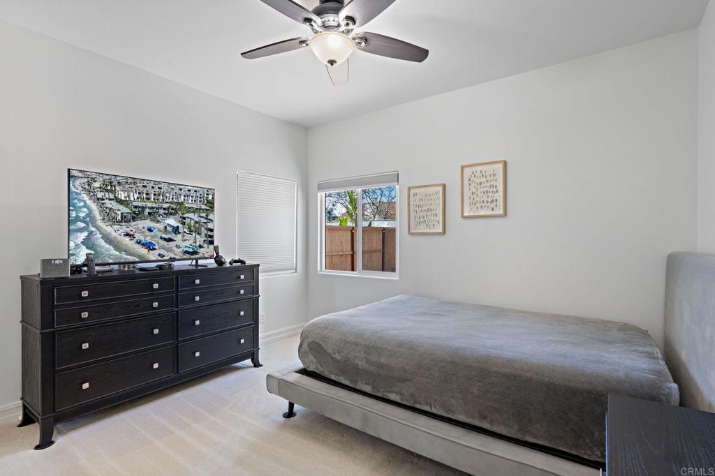 655 Dimaio Way Escondido, CA 92027 - Photo 23 of 46 a bedroom with a bed and a painting on the wall