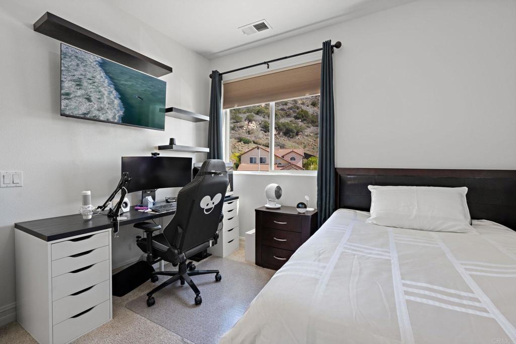 655 Dimaio Way Escondido, CA 92027 - Photo 30 of 46 a bedroom with a bed and a window