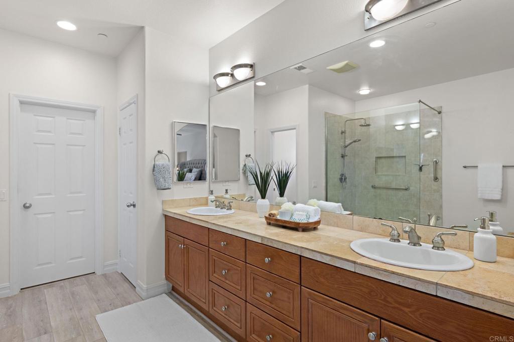 655 Dimaio Way Escondido, CA 92027 - Photo 37 of 46 a bathroom with double vanity sinks and a mirror