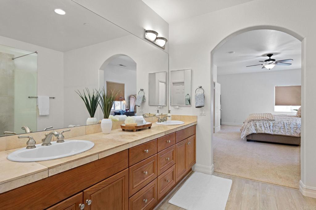 655 Dimaio Way Escondido, CA 92027 - Photo 39 of 46 a en suite bathroom with a double vanity sink double and mirror