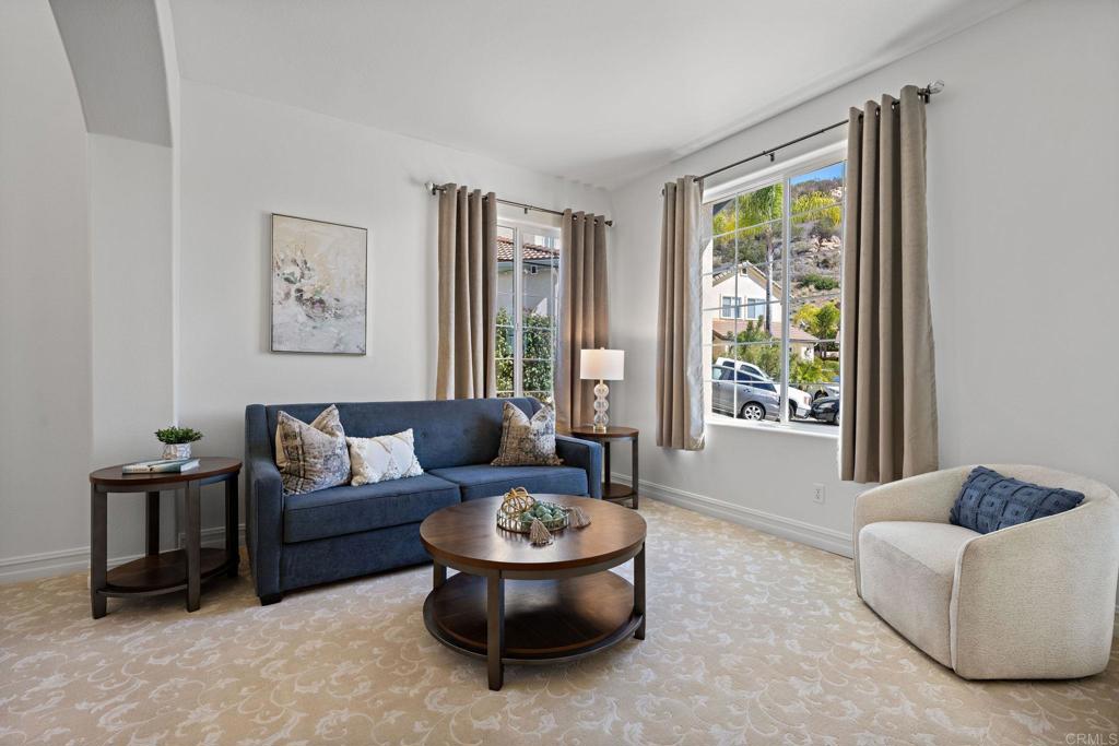 655 Dimaio Way Escondido, CA 92027 - Photo 4 of 46 a living room with furniture and a large window
