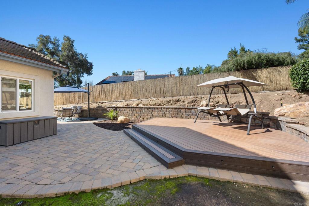 655 Dimaio Way Escondido, CA 92027 - Photo 42 of 46 a view of a swimming pool with a lounge chairs