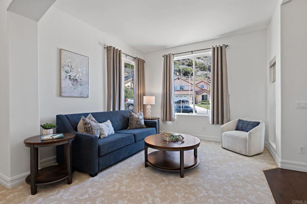 655 Dimaio Way Escondido, CA 92027 - Photo 5 of 46 a living room with furniture and a large window